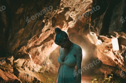 Preview: Woman covered with dust standing in cave
