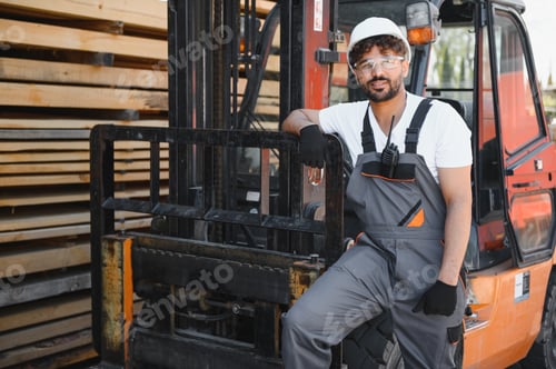 Preview: Warehouse worker leaning on forklift with lumber in background