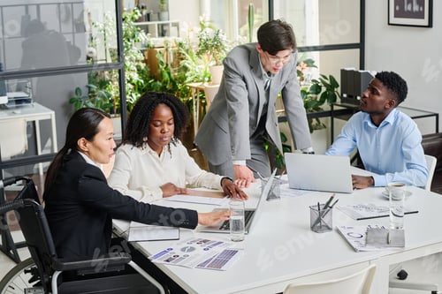 Preview: Business people working in team at meeting