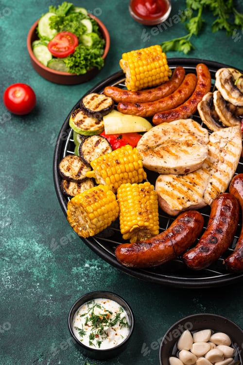 Preview: Grilled sausages, meat, and vegetables