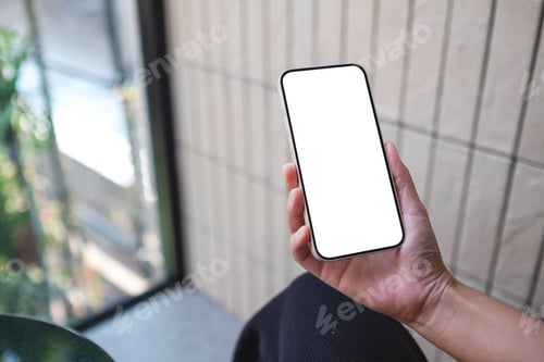 Preview: Mockup image of a woman holding and using mobile phone with blank desktop screen
