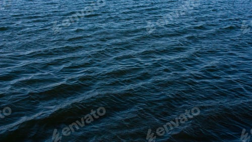 Preview: Aerial shot of abstract dark blue wavy sea water surface background