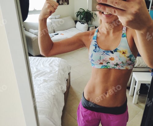 Preview: For woman showing her bicep in the mirror selfie