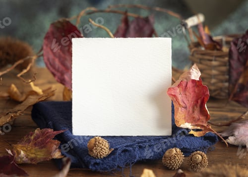 Preview: Card on wood near autumn dried leaves closeup, wedding and party mockup in blue, red and orange