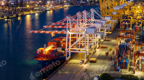 Preview: crane loading cargo container from truck to container ship in the international