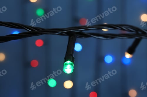 Preview: Beautiful Christmas lights on color background, closeup