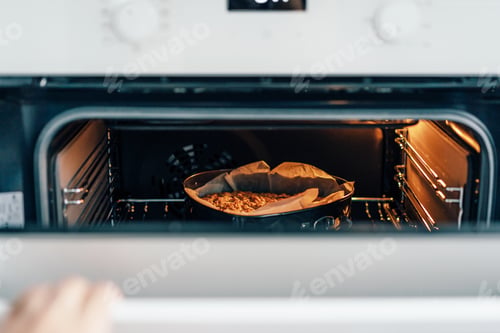 Preview: There is a pie in the oven. Homemade fragrant baked goods.