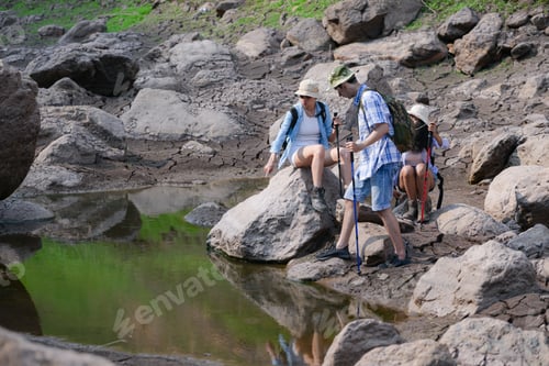 Preview: A group of friends going hiking in the streams of the tropical forest area.