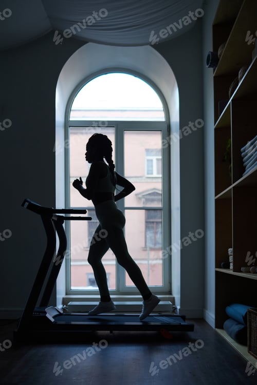 Preview: Exercising on Treadmill in Front of Large Window