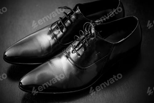 Preview: Closeup shot of classy black leather shoes for groom