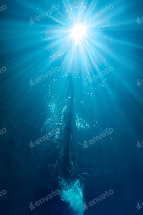 Preview: underwater picture of professional swimmer exercising in swimming pool
