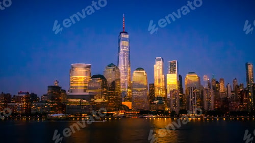 Preview: New York City Skyline with Skyscrapers Illuminated at Dusk