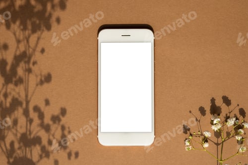 Preview: Smartphone on brown pastel colored background. Mobile phone Mock up for game