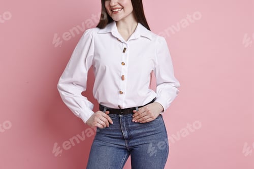 Preview: Smiling woman in stylish jeans on pink background, closeup