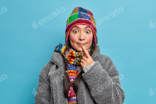 Preview: Playful Woman Wearing Colorful Hat and Cozy Coat