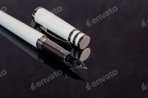 Preview: Fountain pen on marble and gray background. Gift concept.