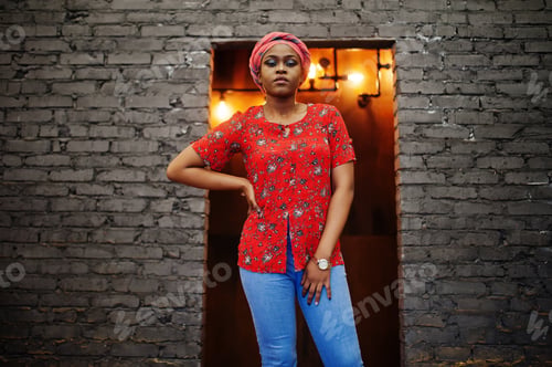 Preview: Stylish african woman in red shirt and hat