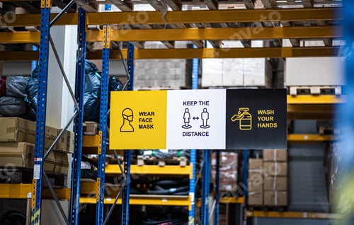 Preview: Safety signs on shelves indoors in warehouse, coronavirus concept.