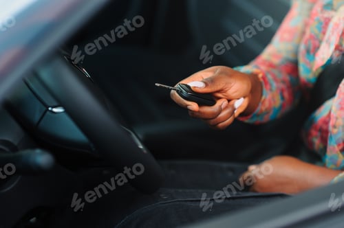 Preview: Women buying the car. Ladies in a car salon. Black girls near white car