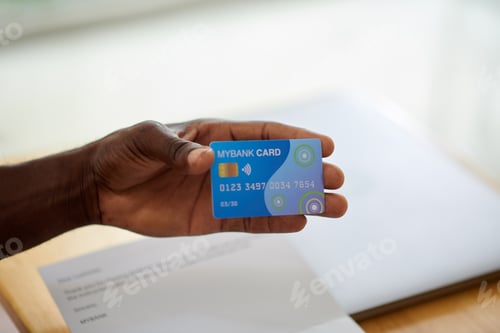 Preview: Black Man Showing Credit Card