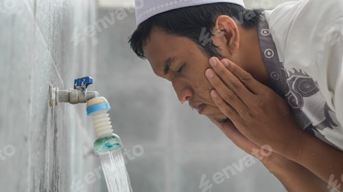 Preview: A portrait of an asian muslim ablution at mosque before pray