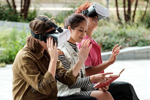 Preview: Three young women are trying a virtual reality device for the first time