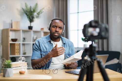 Preview: African american man doing live stream at home