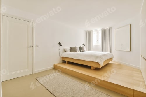 Preview: a bedroom with a wooden platform bed and a rug