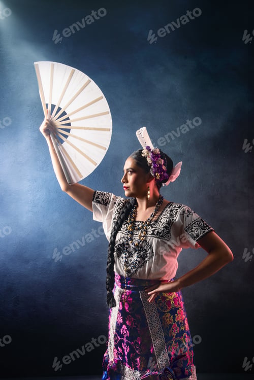Preview: A woman wearing a white shirt and a purple skirt is holding a white fan