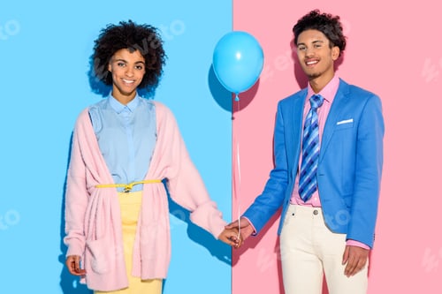 Preview: Young couple holding hands with air balloon on pink and blue background