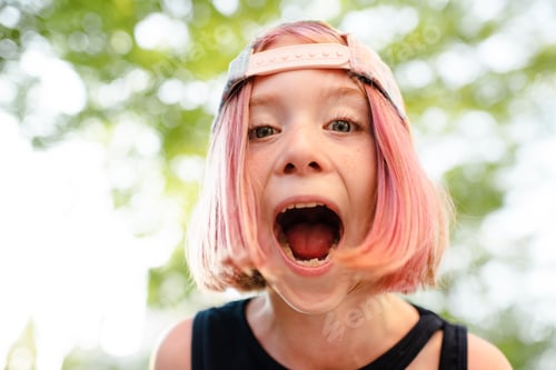 Preview: Funny teen girl with pink hair wearing cap