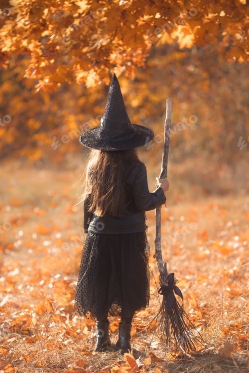 Preview: Faceless portrait of young girl with beautiful long brown hair dressed as a witch from behind
