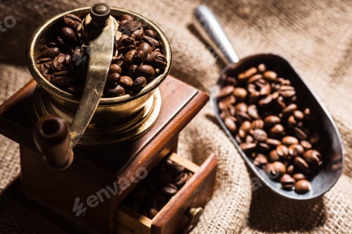 Preview: close-up shot of vintage coffee grinder with scoop on sackcloth