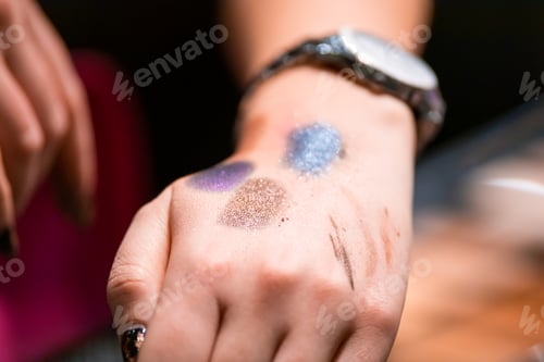 Preview: Customer woman testing cosmetics in beauty store before buying