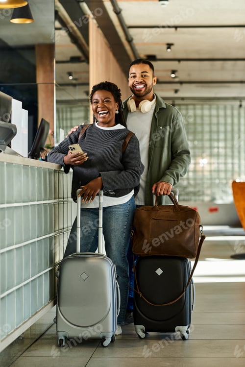 Preview: Young Black couple checking in at a hotel, excited for their vacation adventure