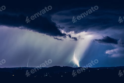 Preview: Night landscape on a background of thunderstorms. Rural silhouette and clouds with lightning flashes