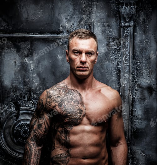 Preview: Portrait of muscular male with tattoo.