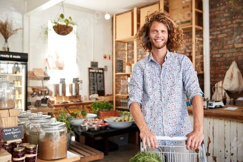 Preview: Portrait Of Man With Trolley Buying Fresh Fruit And Vegetables In Plastic Free Grocery Store
