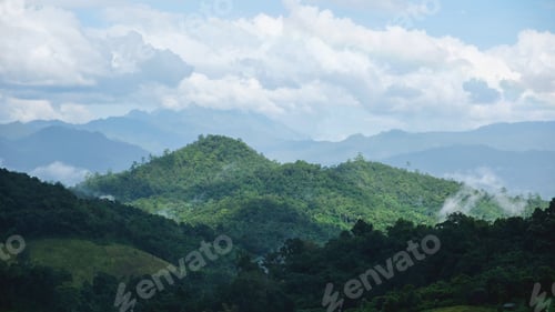 Preview: Landscape image of mountains and hills with cloudy sky on rainy day