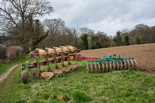 Preview: Horizontal shot of the ploughing machine in the middle of the field