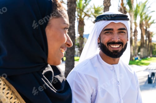 Preview: Traditional arab couple wearing emirati clothing dating outdoors