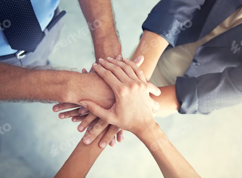 Preview: Go team. High angle shot of a business team putting their hands in a huddle.