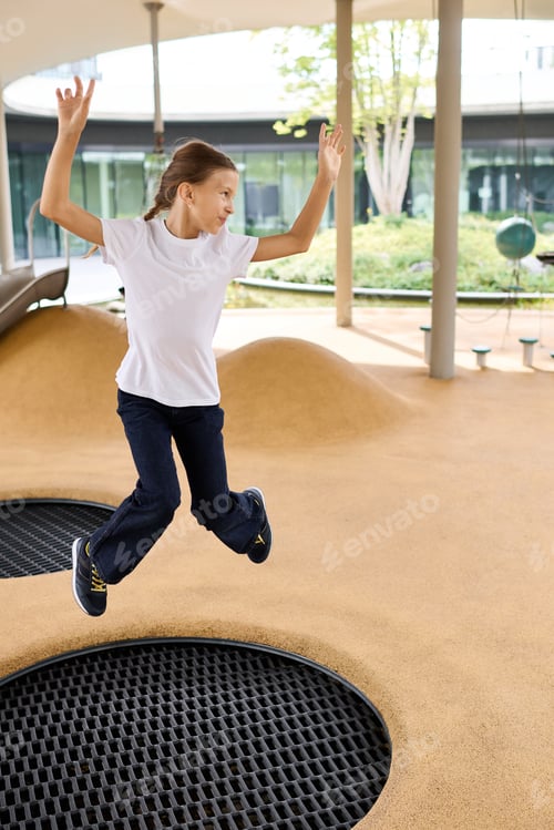 Preview: Joyful childhood moments in the autumn playground with spirited leaps and laughter