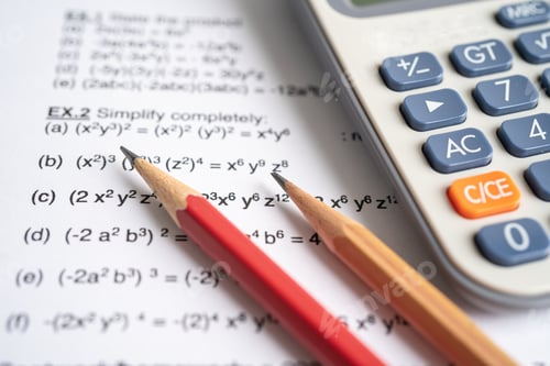 Preview: Pencil and calculator on mathematic formula exercise test paper in education school.