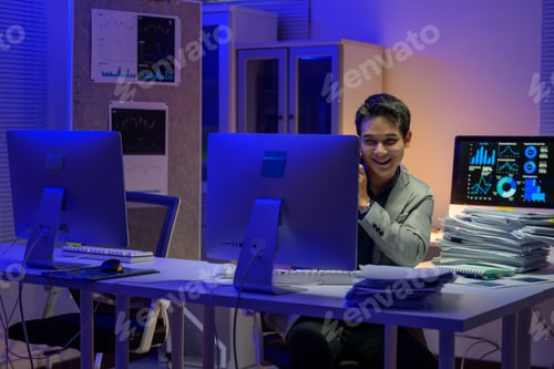 Preview: Stock market broker working late at night is making a phone call