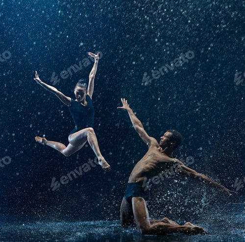 Preview: Young couple of ballet dancers dancing unde rwater drops