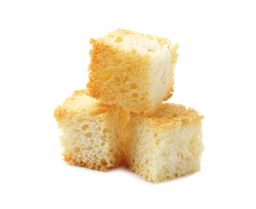Preview: Three delicious crispy croutons isolated on white