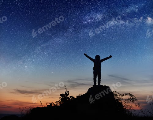 Preview: Astronaut standing on top of mountain under night sky.