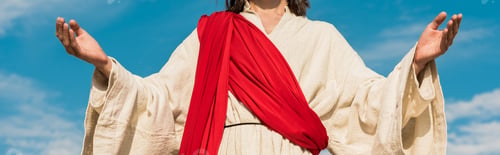 Preview: panoramic shot of jesus with outstretched hands against blue sky