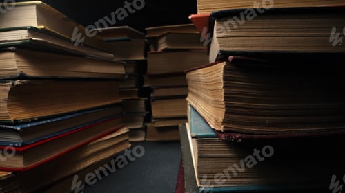 Preview: Library stack of old books, background of rows in antique shop, bookstore.